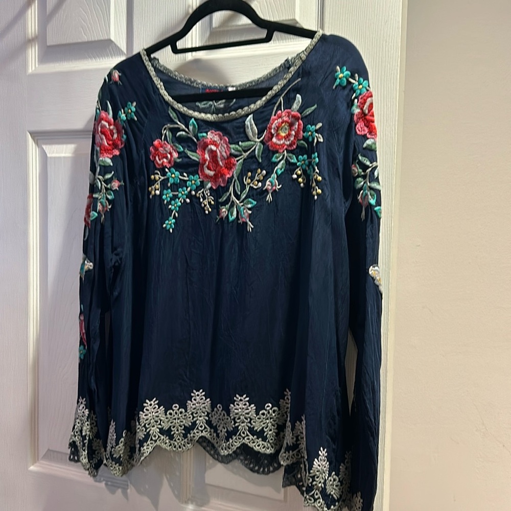 Beautiful blue top. Flowy with embroiderery

Gently used. Pit to pit 24
Inches